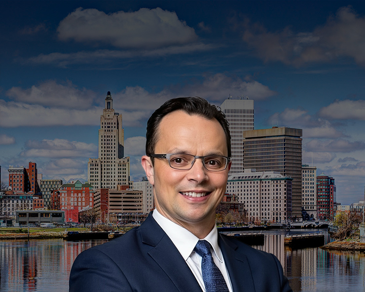 David Tapalian with the Providence Rhode Island Skyline with a dark filter in the background